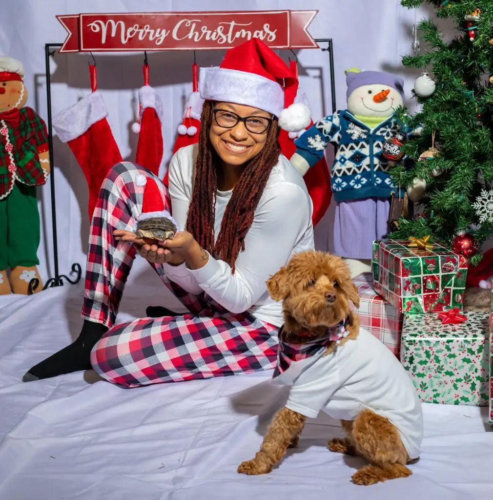 A girl and a dog in Christmas Pyjama