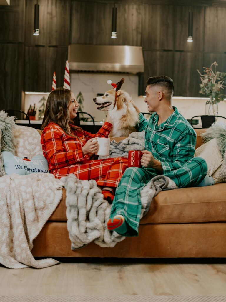 Couples with a dog in Christmas pyjama